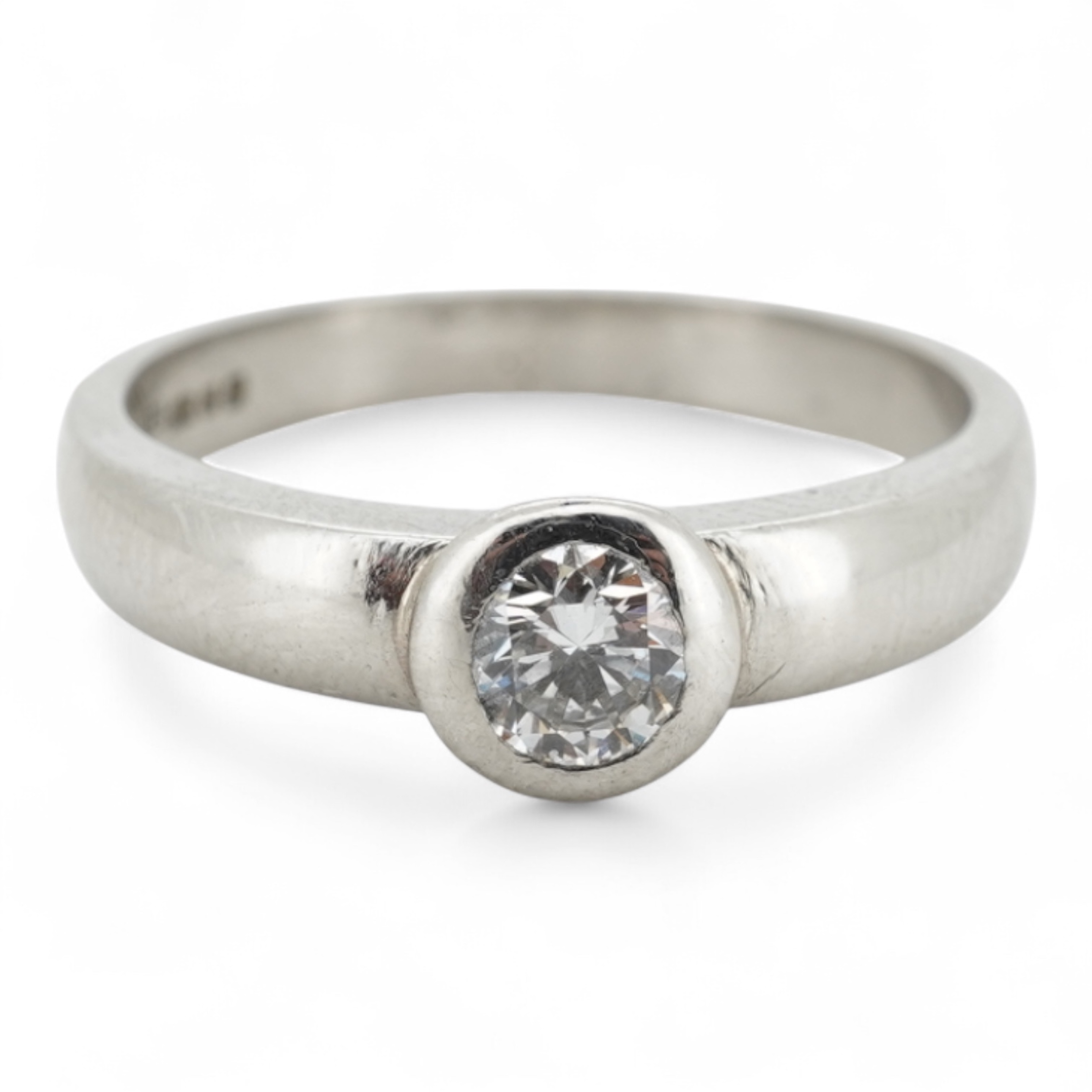 A diamond ring, collet-set with a brilliant-cut diamond weighing approximately 0.52 carats, mounted in platinum, size K1/2, British hallmarks, gross weight approximately 4 grams